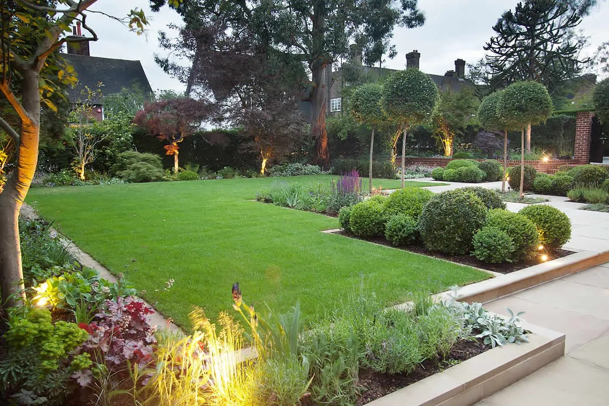 Evening garden with professional landscape lighting